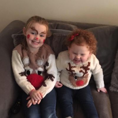 Grace and Georgia in Xmas jumpers.jpg