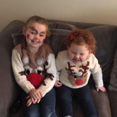 Grace and Georgia in Xmas jumpers.jpg